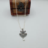 Austro-Hungarian style, adorned with mother-of-pearl natural pearl and garnet pendant